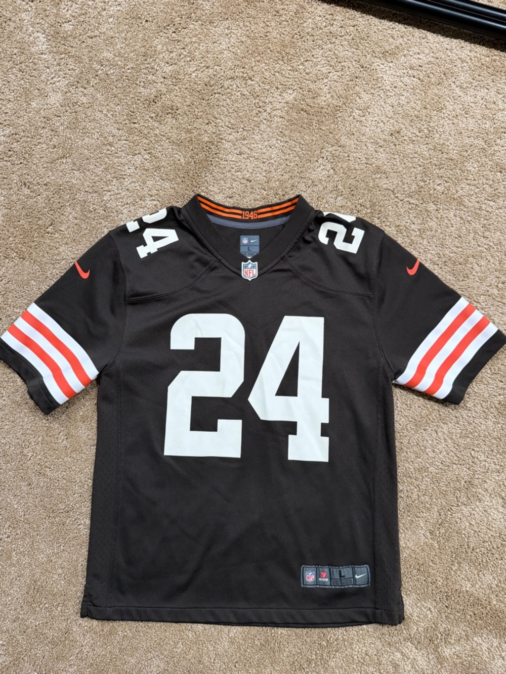 Nike Kids Black Football Jersey with White Numbers and Orange Accents